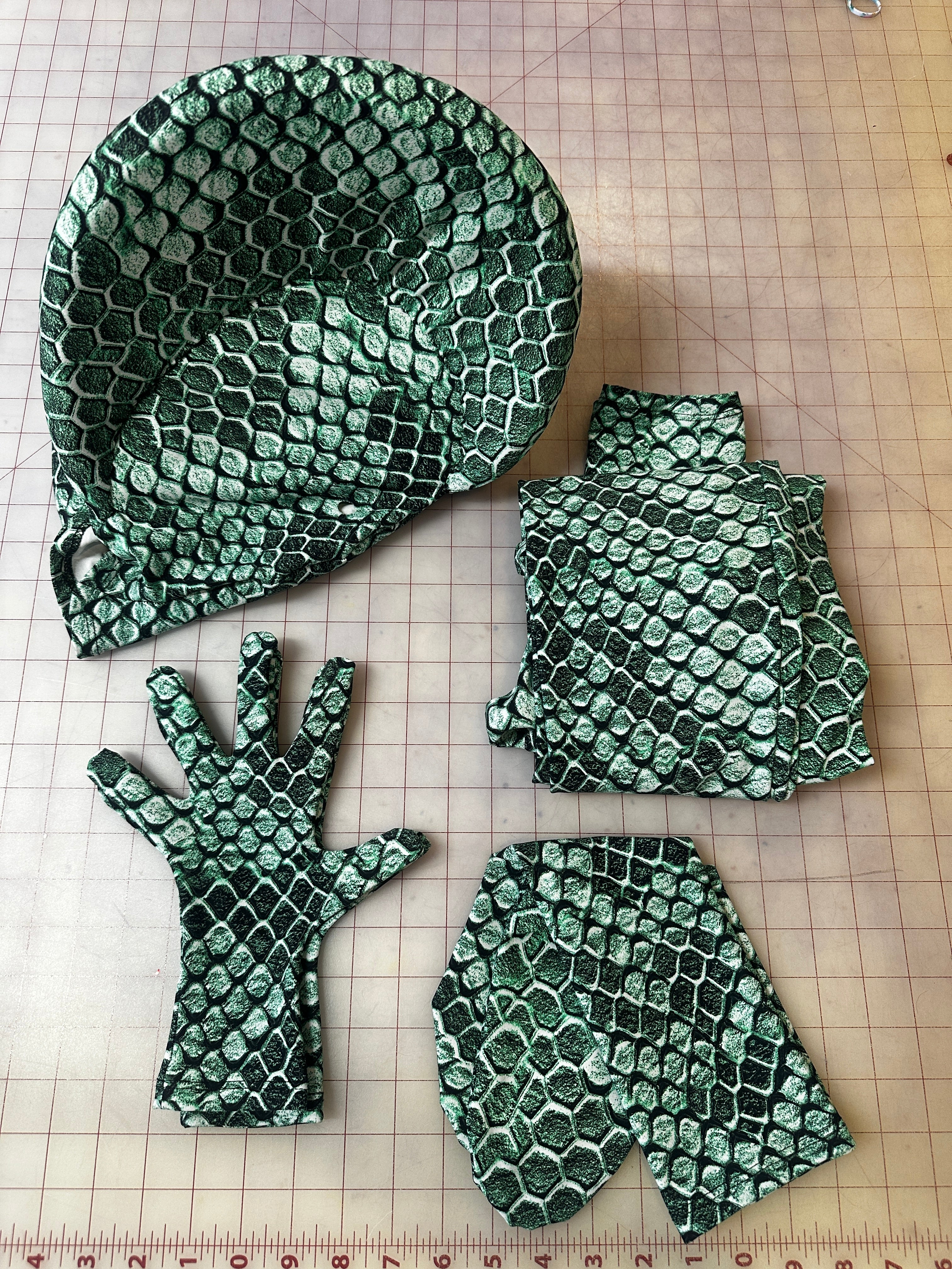 The Green pixel Cobra Costume is a custom-made snake print catsuit with a serpent headdress—perfect as a contortionist outfit or dance unitard for your next cosplay or spandex performance.