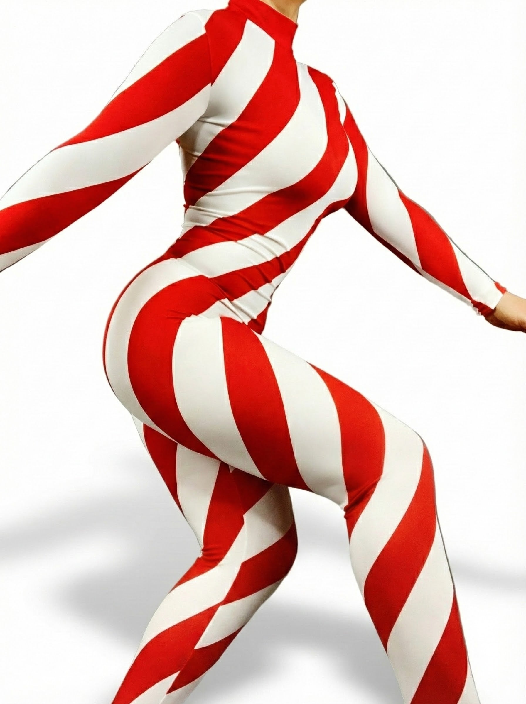 Model wears the Candy Cane Catsuit Unitard with turtleneck and full sleeves, featuring red and white stripes, standing with arms outstretched against a plain white background.