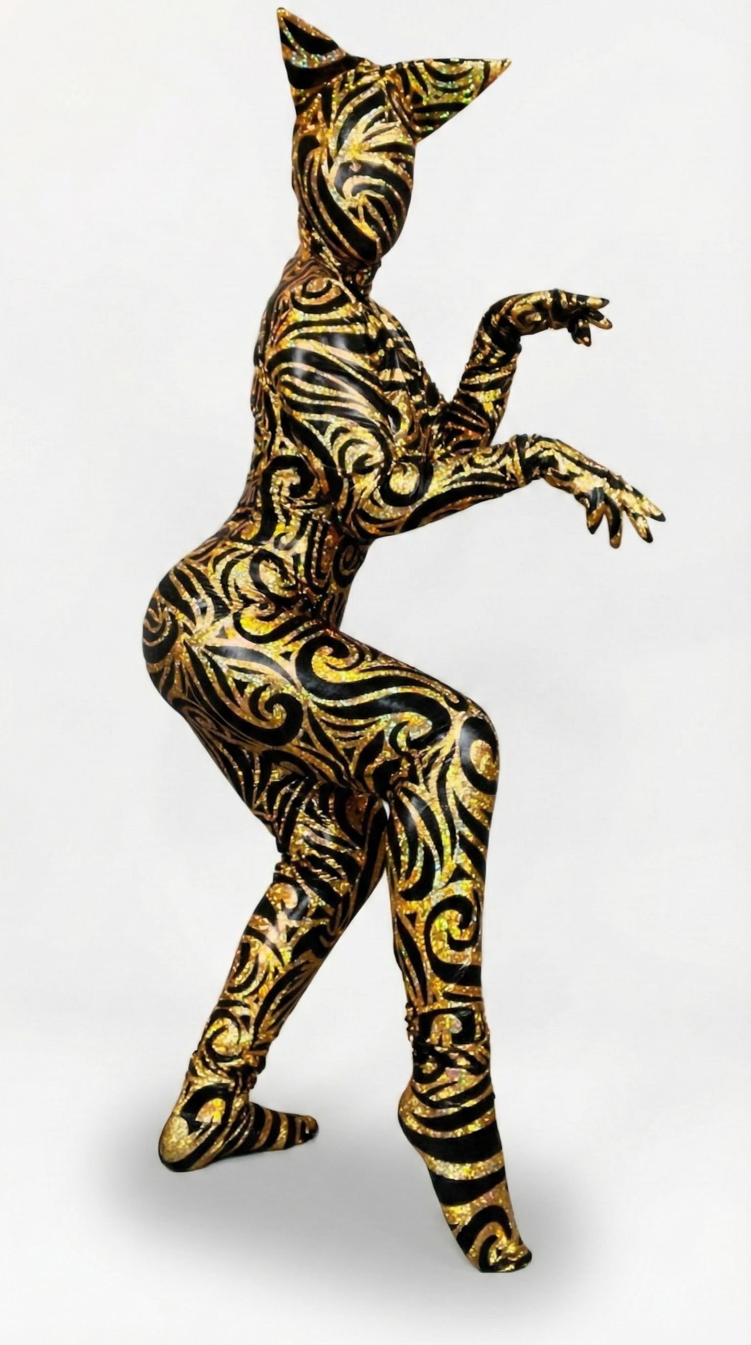 Person models a Cat Costume with a beautiful fantasy headpiece and spandex catsuit, perfect for Halloween or dancewear, in gold and black patterns against a white background. Trending now!.