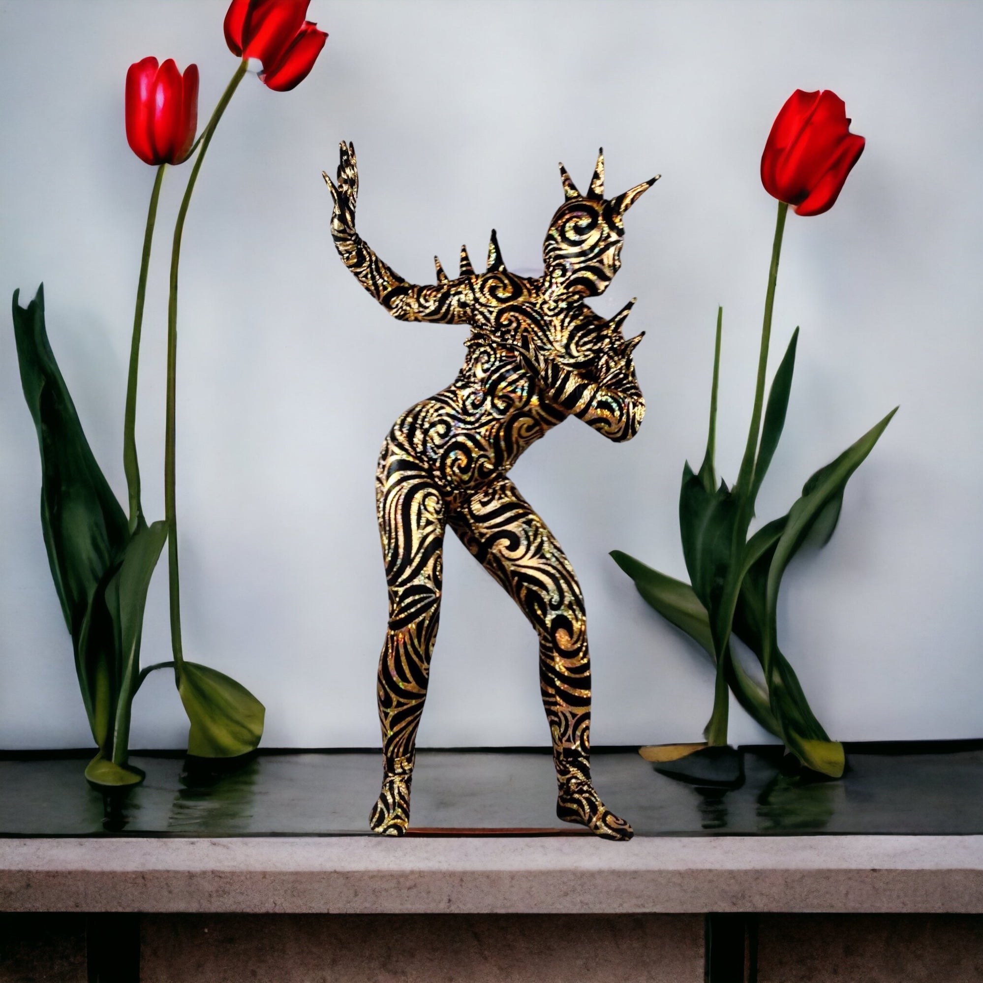 Futuristic ornate statue of a person in an Alien Full Body Costume Set, featuring a Turtleneck Catsuit, Spiked Accessories, and Open-Eye Headpiece, surrounded by two red tulips on a stone ledge.