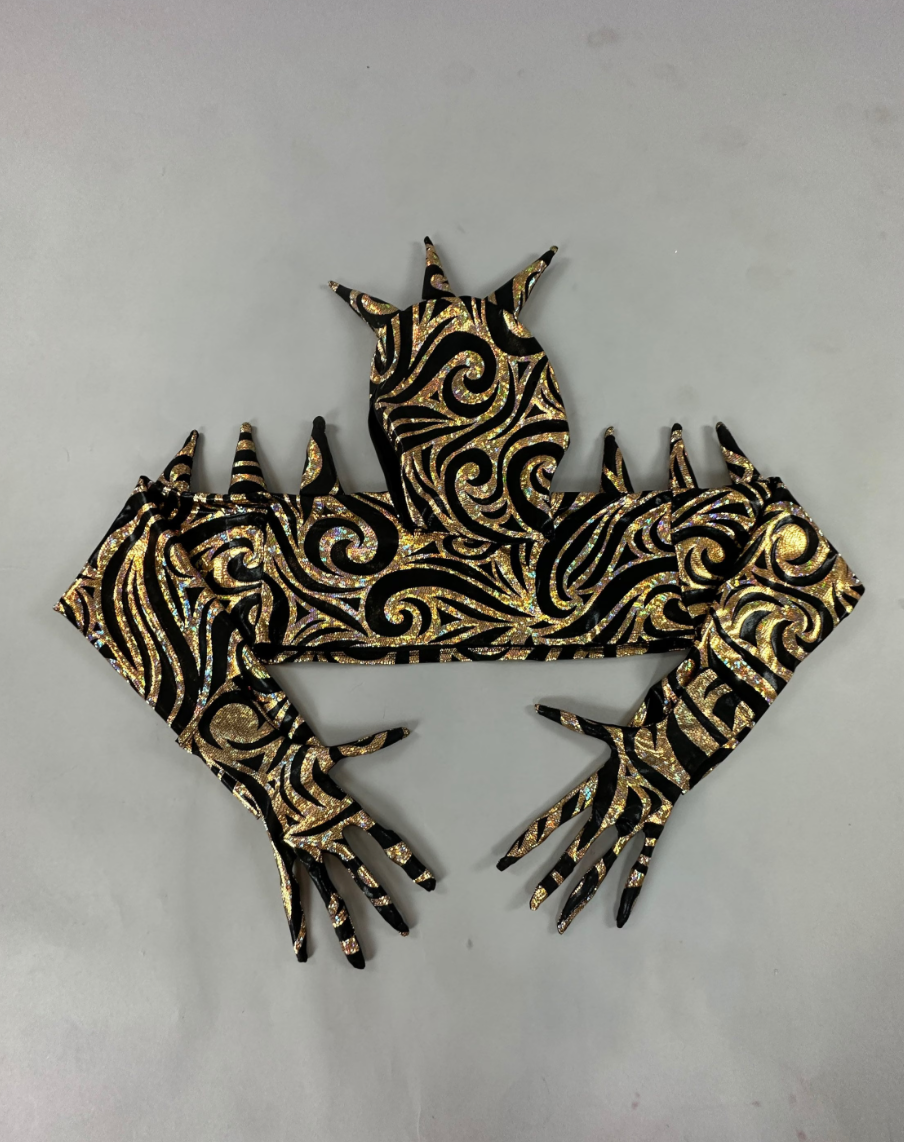 The abstract sculpture of hands and arms features intricate black and gold swirling patterns on a gray background, echoing the futuristic design akin to the sleek appeal of an Alien Full Body Costume Set with Turtleneck Catsuit, Spiked Accessories, and Open-Eye Headpiece.