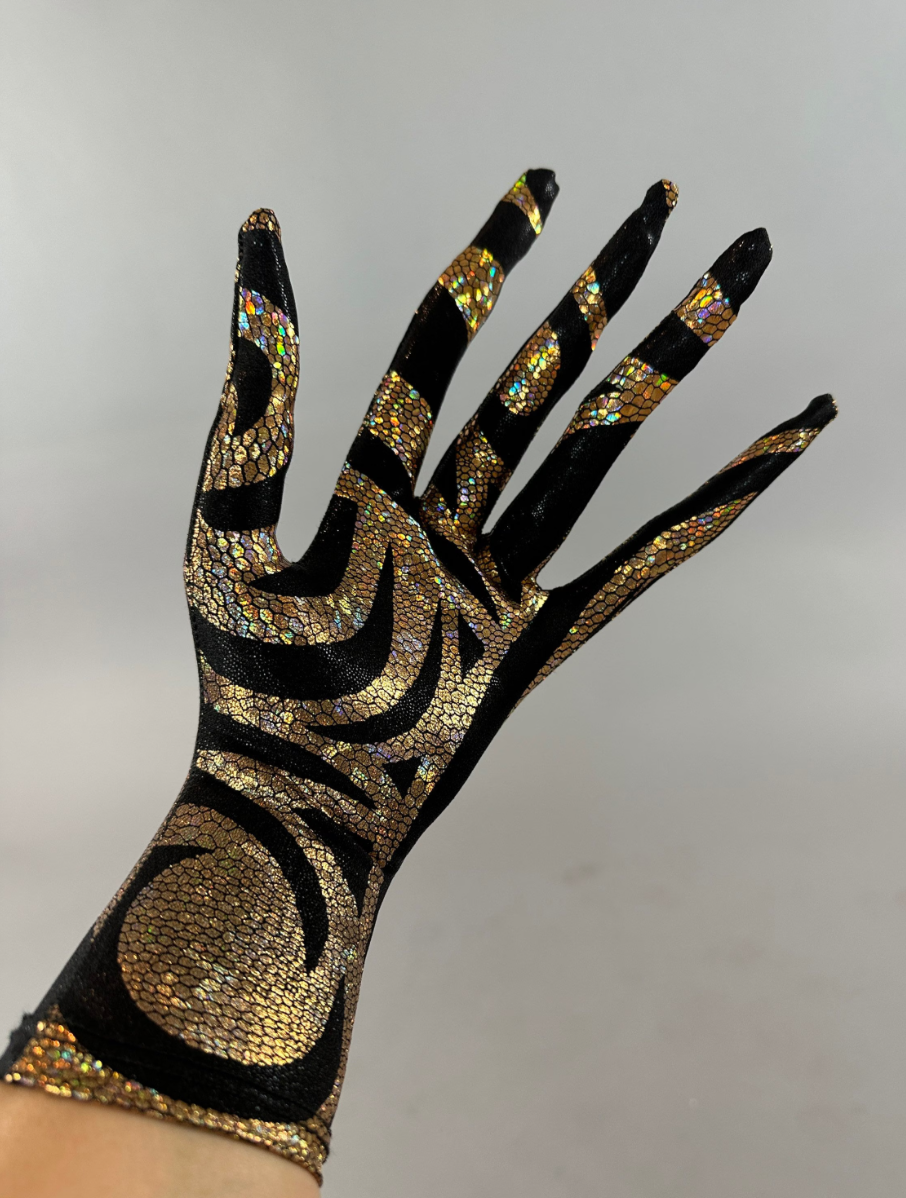 The Alien Full Body Costume Set features a turtleneck catsuit adorned with intricate black and gold geometric patterns that sparkle, exuding a futuristic design aesthetic.