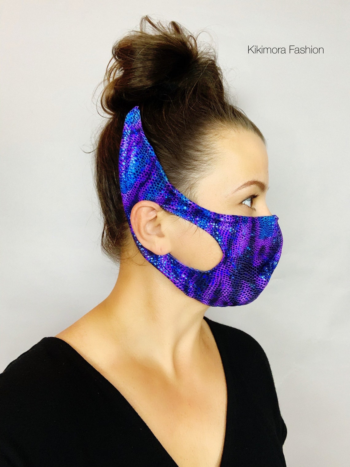 Woman in a reusable Elf Ears Face Mask, Mandalorian Baby Yoda inspired, side profile—an artistic handmade mask perfect for fans of sustainable fashion and creative Baby Yoda costumes.