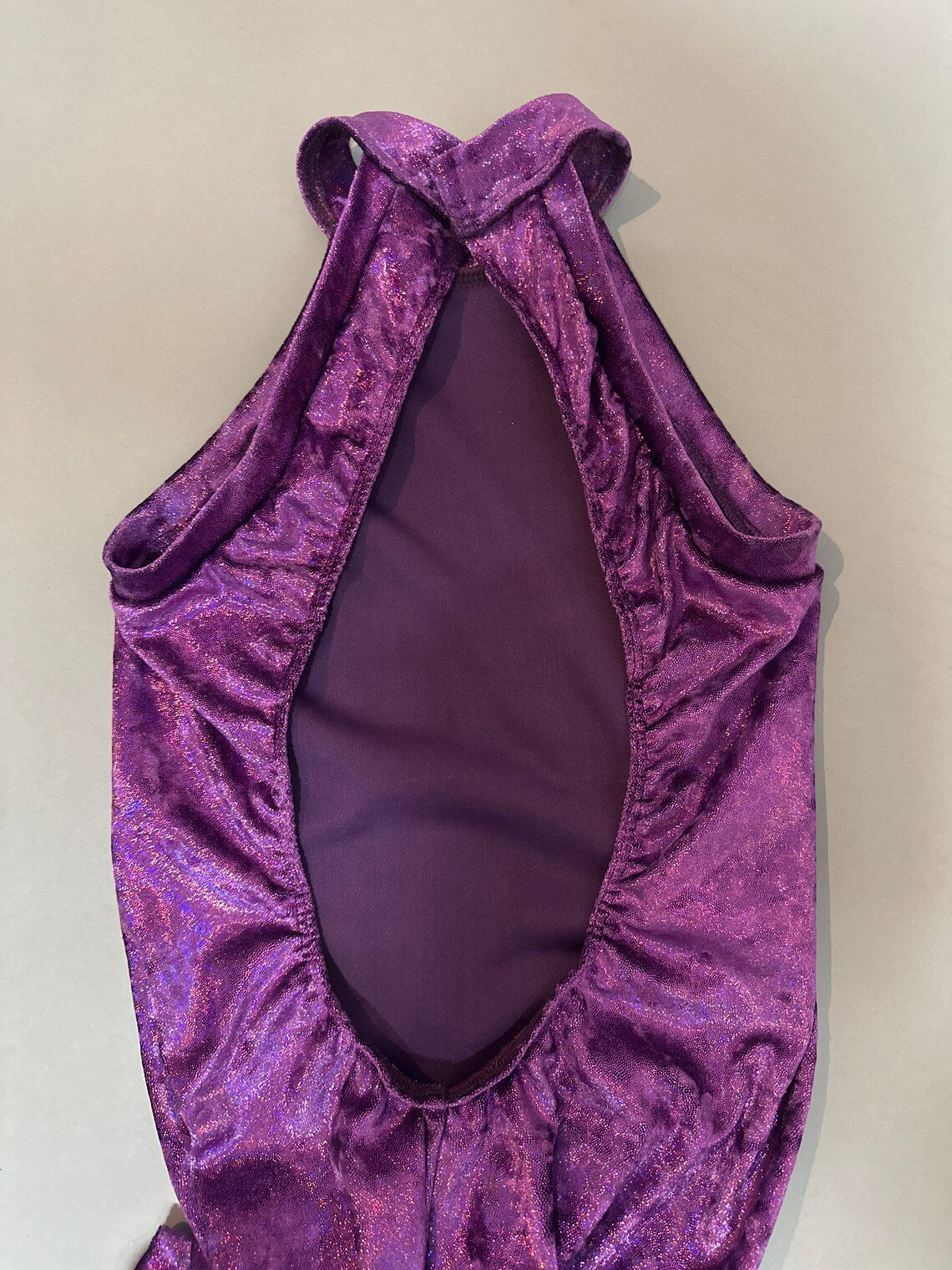 The Velvet Open Back Jumpsuit features a stylish open back and trendy design—perfect for exotic dance wear, festival outfits, or as a fashionable bodysuit costume.