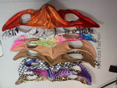 Five vibrant Elf Ears Face Masks from Kikimora Fashion, inspired by Mandalorian Baby Yoda, are stacked on a table. These reusable masks feature futuristic patterns and pointed designs, perfect for all ages.