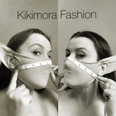 Two women pose wearing the Face Mask, Elf Ears Cosplay Costume Accessory, Breathing Face Mask; a tape measure is stretched across their faces beneath the "Kikimora Fashion" text.