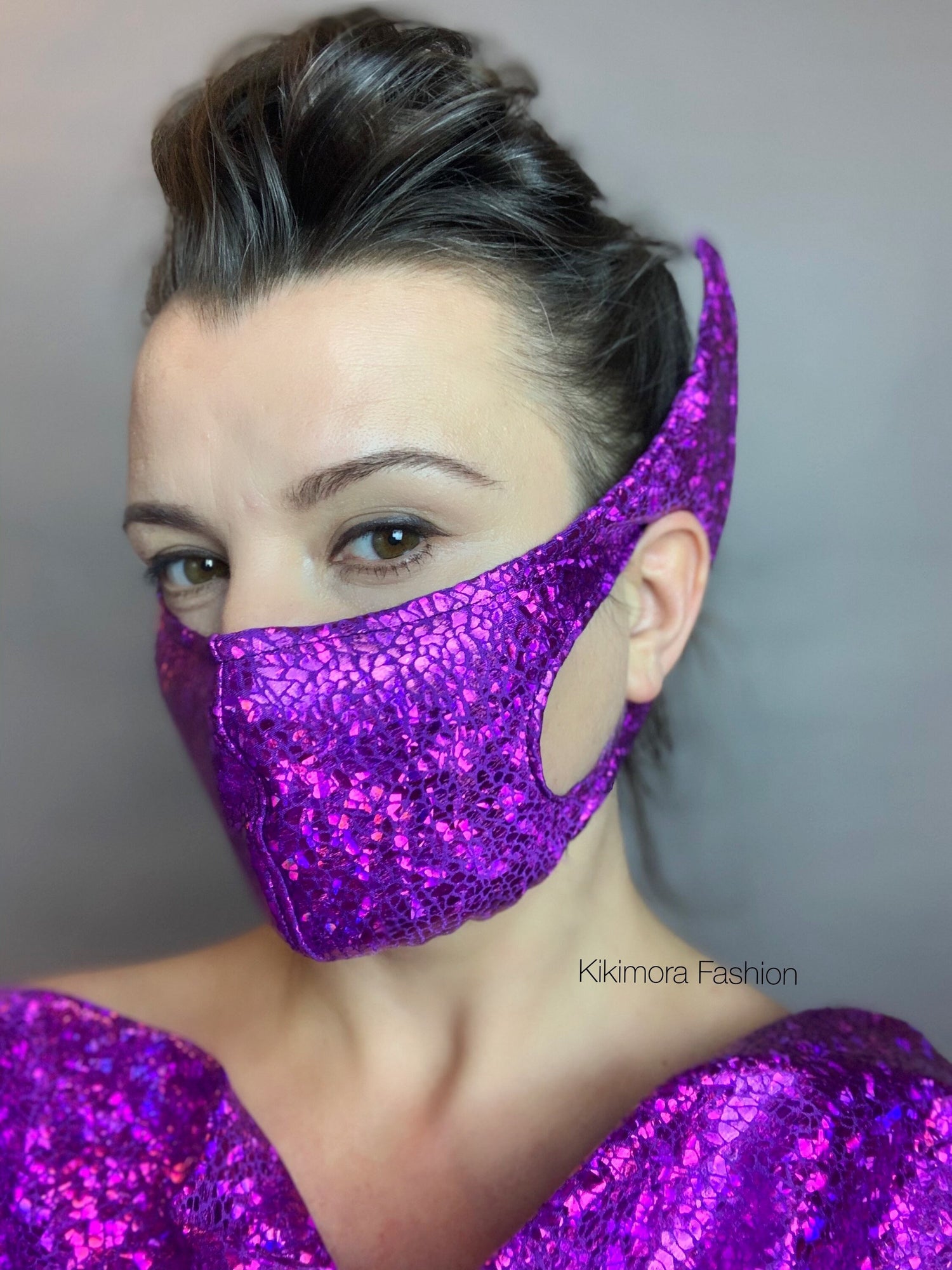 Woman wears the Elf Ears Face Mask for All Ages—beautiful, futuristic, reusable mask inspired by Baby Yoda—with a matching outfit. "Kikimora Fashion" appears on the image.