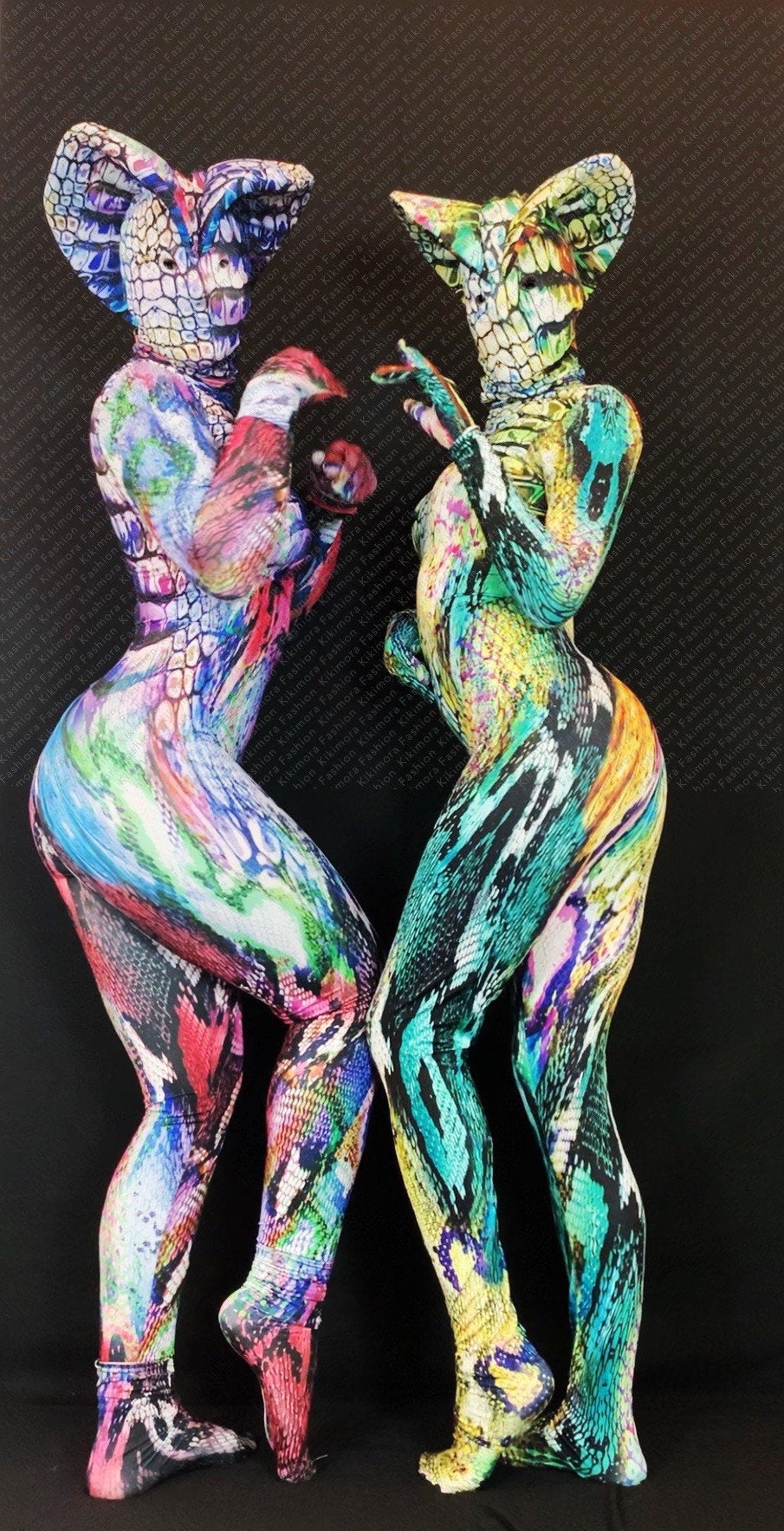 Two people in Fantasy Creature Snake Costume jumpsuits for women or men—vibrant Zentai fashion with bold snake print—pose playfully against a dark background, showcasing this exotic dancewear and contortionist unitard design.