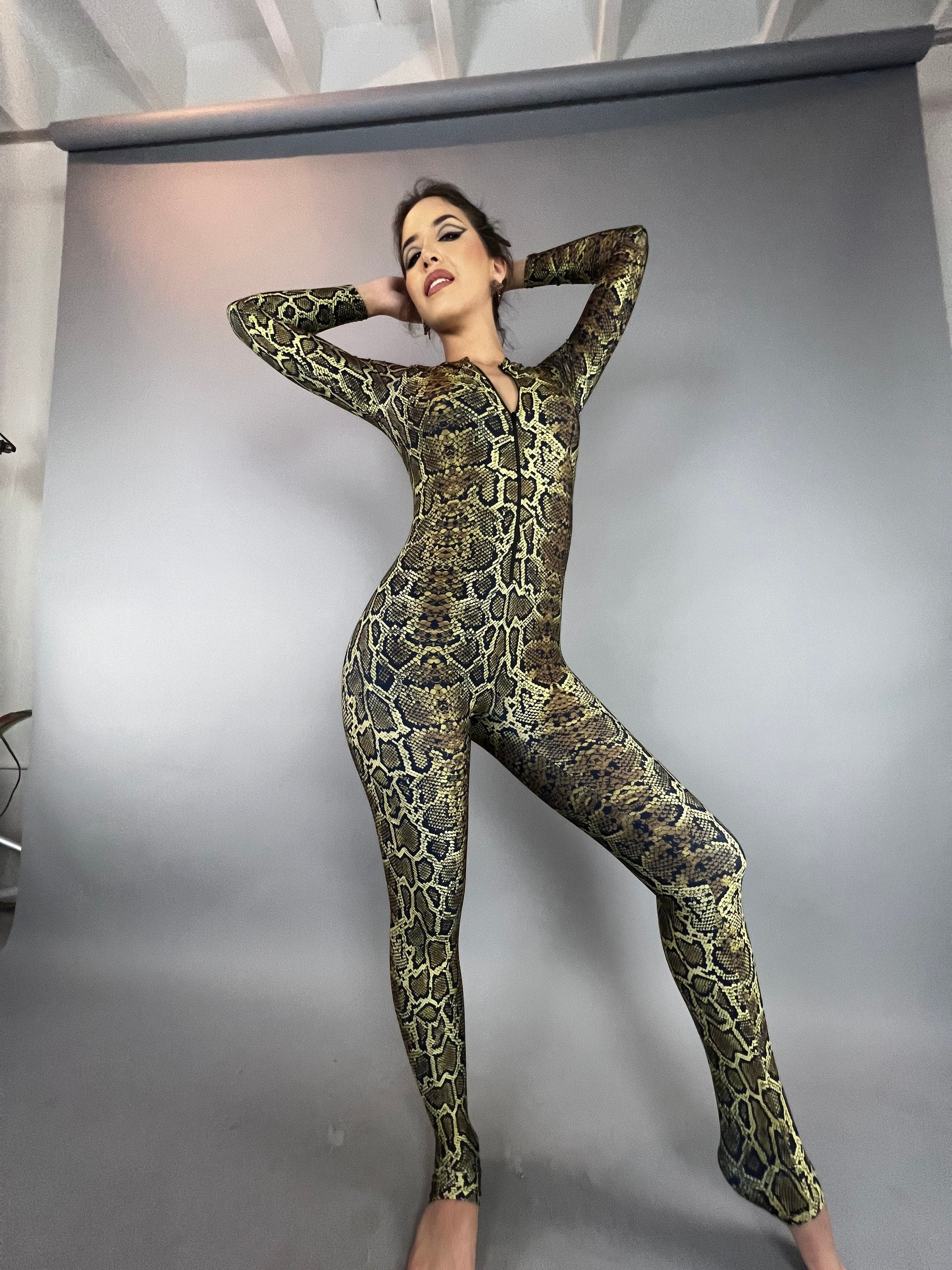 Woman models the Beautiful Snake Catsuit—UV protective festival fashion perfect for watersports, yoga, and trending swimsuits—against a plain studio backdrop.