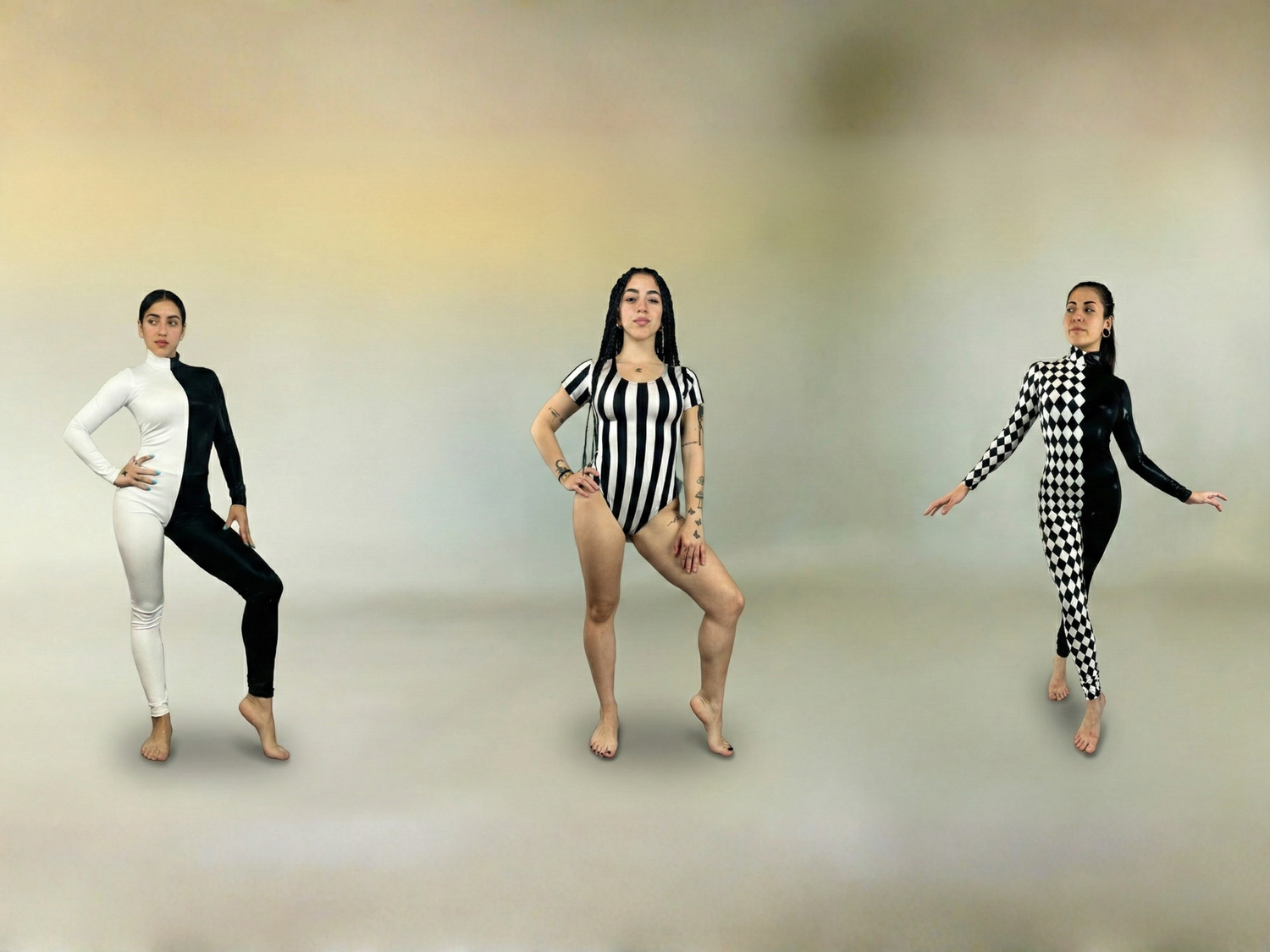 Three women pose in black and white outfits: half-and-half, striped, and checkerboard patterns, against a plain background.