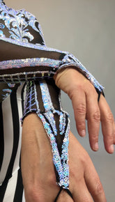 A close-up of a hand in a glamorous sequined-stripes mesh glove with finger loops, perfectly complementing an iridescent green Glamorous sequins Stripes Catsuit costume.