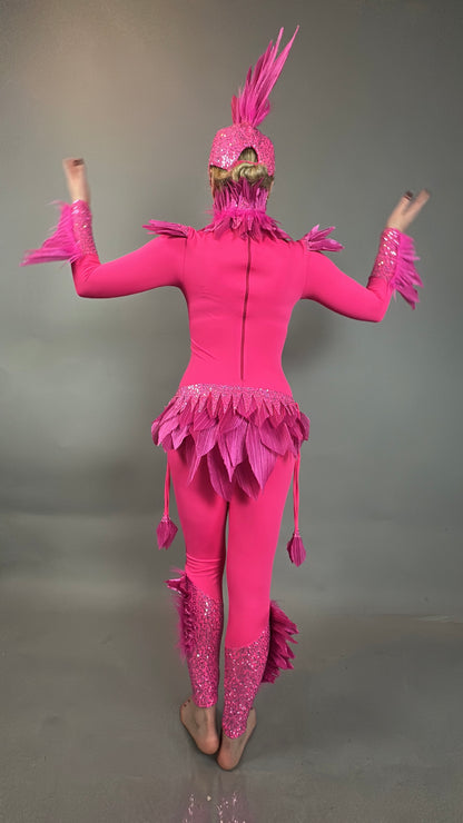 A person wears the Pink bird full costume for aerial gymnastics, dancers, and TV productions, standing barefoot with raised arms against a gray background.