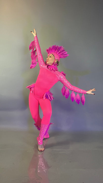 Person wearing the "Pink bird full costume for aerial and dancers" poses with arms raised and one leg bent on a plain background—ideal for theatrical performances.