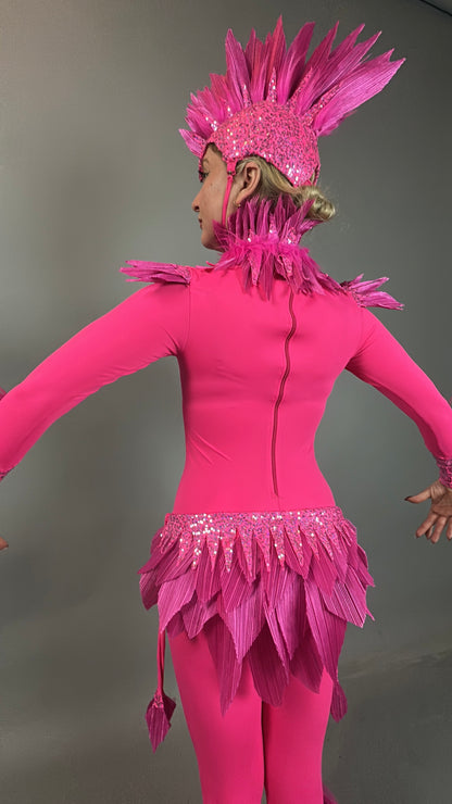 Seen from the back with arms outstretched, a person wears the Pink bird full costume—ideal for aerial gymnastics, dancers, and TV productions—featuring feather-like details and bright pink bird-inspired design.