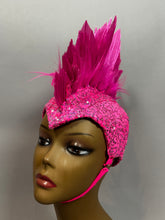 A mannequin models the Pink Bird Headpiece, a bright pink festival accessory with sequins, tall spiky feathers, and a chin strap—perfect for fairies, aerialists, theatrical costumes, or rave outfits.