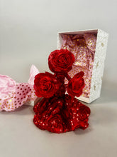 The Mini Living Rose sculpture is a handcrafted doll ornament featuring three red roses in a dress shape, displayed with a Kikimora Studio decorative box lined with pink fabric.