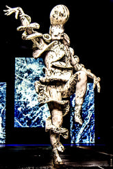Avant-garde full body suit featuring a marble print spandex design, this Mushroom Creature Costume showcases exaggerated limbs and textured, fungus-inspired patterns, striking a dramatic pose—ideal as artistic UV glow performance wear or a custom-fit statement piece.