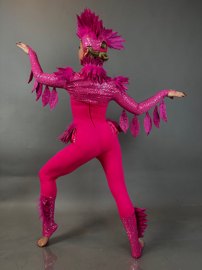 A performer in the Pink bird full costume for aerial and dancers poses with arms raised against a gray background, showcasing the energetic style of this stage-ready outfit.