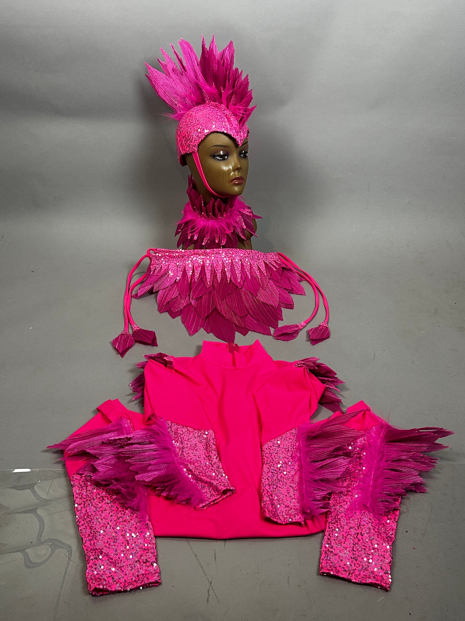 The Pink bird full costume for aerial gymnastics, dancers, and TV productions features vibrant feathers, sequins, matching arm sleeves, collar, and headdress for a striking theatrical look.