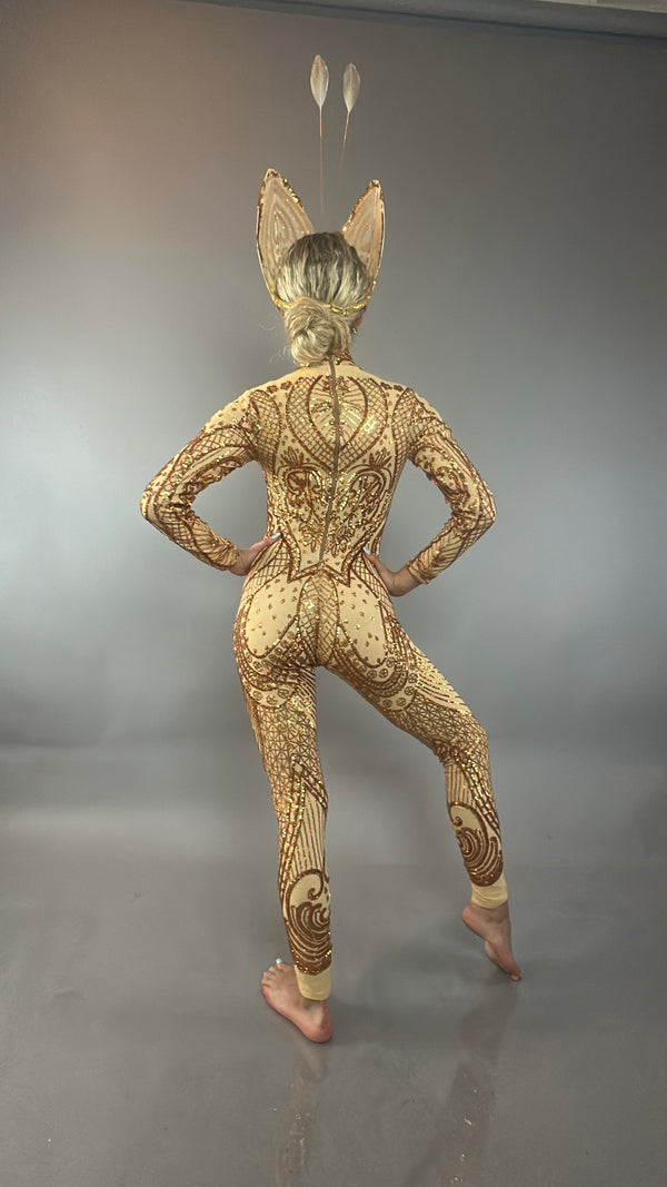 Barefoot model in an ornate bodysuit and headpiece poses against a plain gray background, facing away from the camera to showcase the Golden Butterfly Sparkling Sequin Full Costume.
