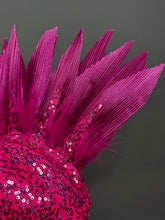 A close-up of the Pink Bird Headpiece shows bright pink feather-like spikes and sequins, perfect as a fairy hat accessory or festival outfit, set against a gray background.
