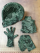 The Green pixel Cobra Costume is a custom-made snake print catsuit with a serpent headdress—perfect as a contortionist outfit or dance unitard for your next cosplay or spandex performance.