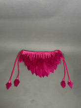 A pink bird full costume for aerial gymnastics, dancers, and TV productions is displayed on a plain gray background, featuring petal-like details and four tassels reminiscent of whimsical stage wear.