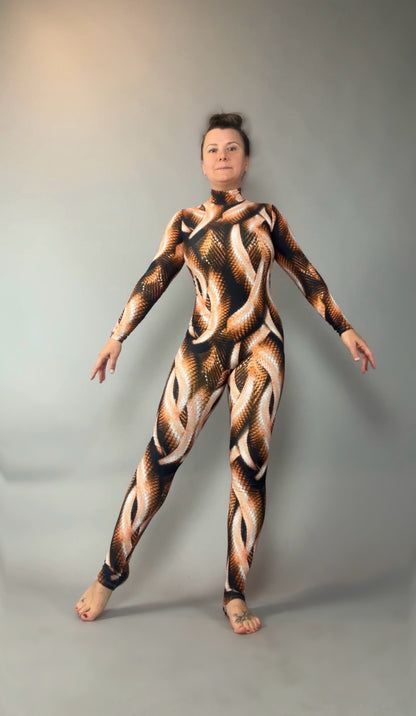 A person stands on one leg, wearing the Brown Snake print Catsuit with turtleneck and long sleeves, set against a gray backdrop.
