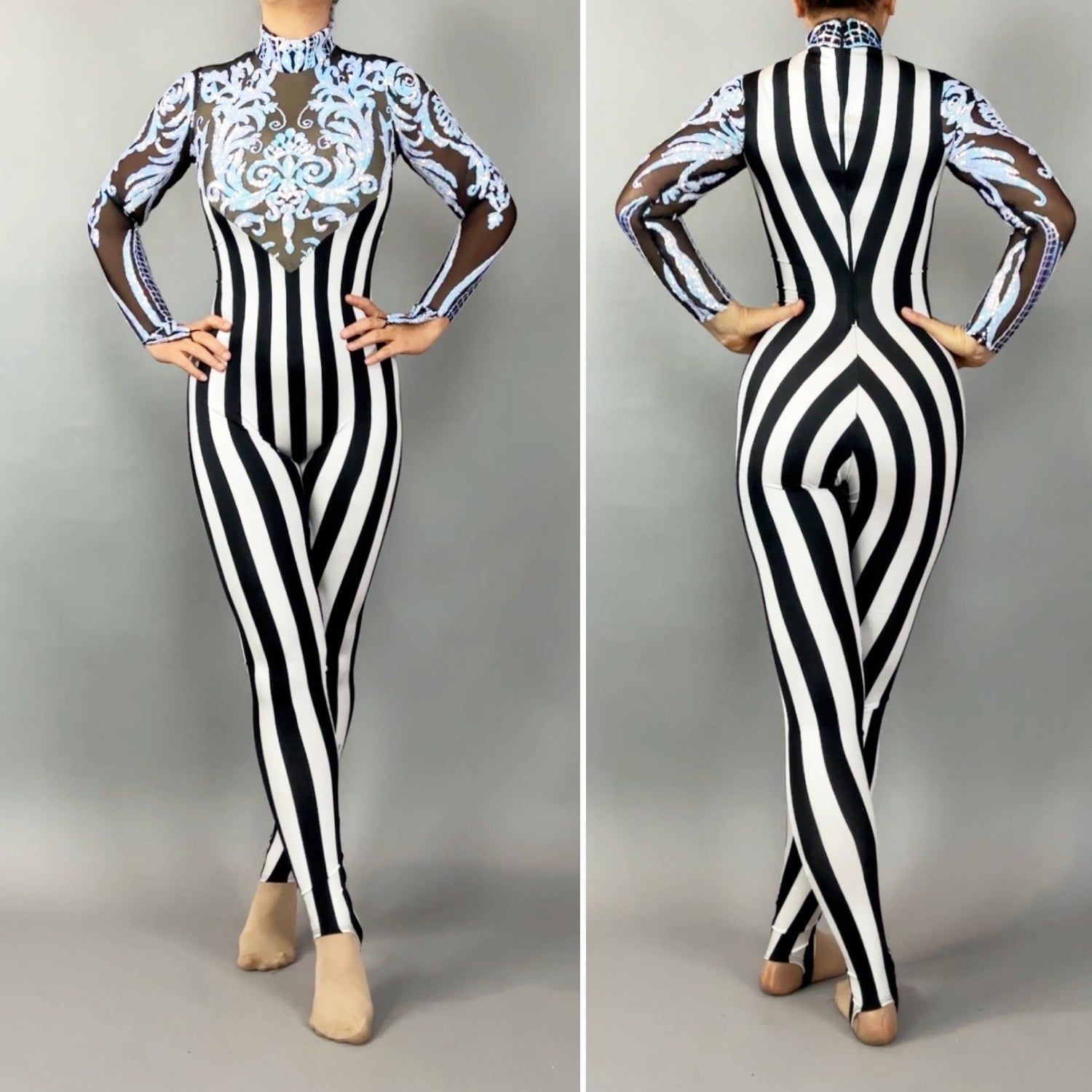 Model styled in the Glamorous sequins Stripes Catsuit costume featuring black and white stripes, sheer sleeves, blue ornate front designs, and sparkling sequined leaf accents.