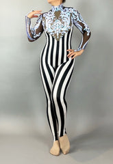 Person wearing the Glamorous sequins Stripes Catsuit, a costume featuring black and white vertical stripes, sheer panels, blue embroidery, and a sequined leaf design.