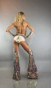 Woman models the Chaps Pants, Laced Top, and Sequins Festival Costume Set—posing with hands on hips and facing away from the camera—for a bold, custom dancewear look that shines on stage.