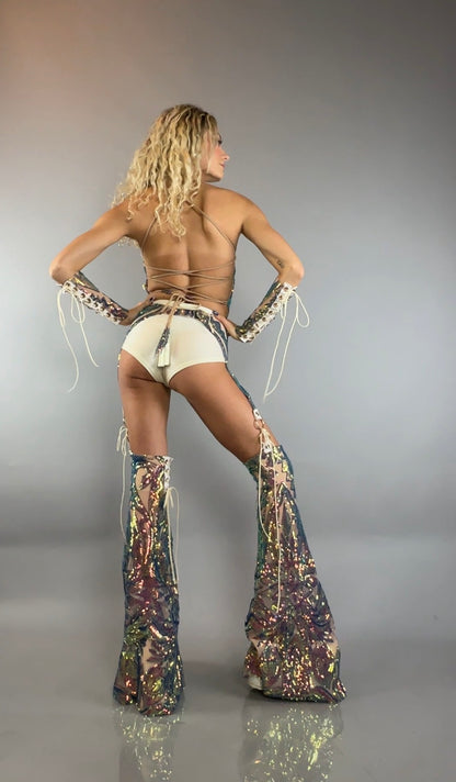 Woman models the Chaps Pants, Laced Top, and Sequins Festival Costume Set—posing with hands on hips and facing away from the camera—for a bold, custom dancewear look that shines on stage.