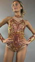 A model poses confidently against a plain gray background wearing the Fire color sparkling Halter Leotard with sequin accents and detachable sleeves.