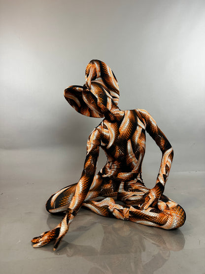A person in a hooded Brown Snake Print Turtleneck Catsuit with Back Zipper sits on the floor.