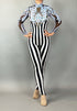 Wearing the Glamorous sequins Stripes Catsuit costume, this person sports black-and-white stripes, sheer sleeves, ornate blue chest detailing, and a sparkling sequined leaf accent.