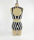 A mannequin wears the Exotic Dance Costume—black and white striped crop top with high-waisted bikini bottoms—shown from the back, perfect as a trending festival outfit.