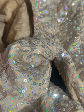 The Champagne Fairy Sequin Catsuit features beige fabric with shiny silver sequins, open back, turtleneck, and sleeves—ideal for a glamorous performance or enchanting costume.