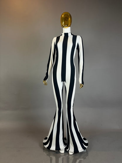 A mannequin showcases the Rave White Striped Catsuit with bellbottom legs, ideal for performance wear, set against a plain background.