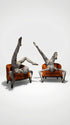 Two people in patterned bodysuits perform acrobatic poses on orange chairs against a plain background, showcasing the Alien Costume—futuristic fashion that&