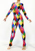 Model wears a Multicolor Catsuit Harlequin Costume featuring full sleeves and a scoop neck with diamond patterns, posed against a plain white background.