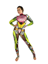 Woman in a vibrant Multicolor Picasso Catsuit with turtleneck and long sleeves, featuring bold abstract patterns, stands barefoot on a white background.