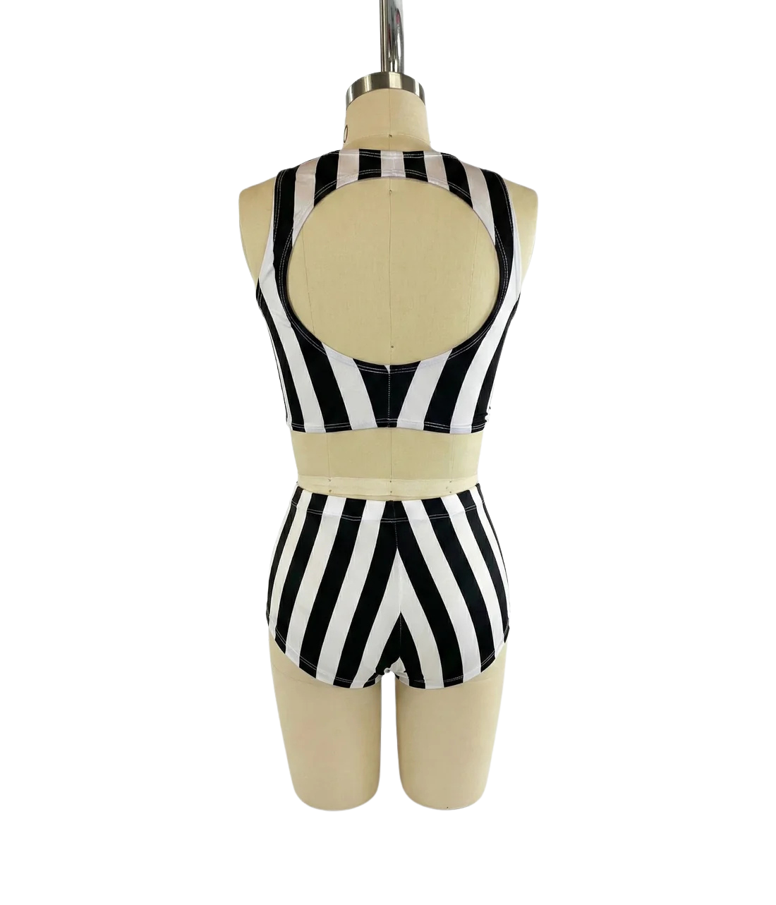 Back view of mannequin wearing the Black and White Striped Dance Costume—spandex crop top and high waist shorts set with open back, ideal for pole dance. 4-way stretch performance wear for trendy dancers.
