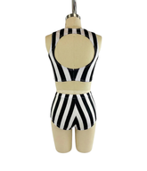 Back view of mannequin wearing the Black and White Striped Dance Costume—spandex crop top and high waist shorts set with open back, ideal for pole dance. 4-way stretch performance wear for trendy dancers.
