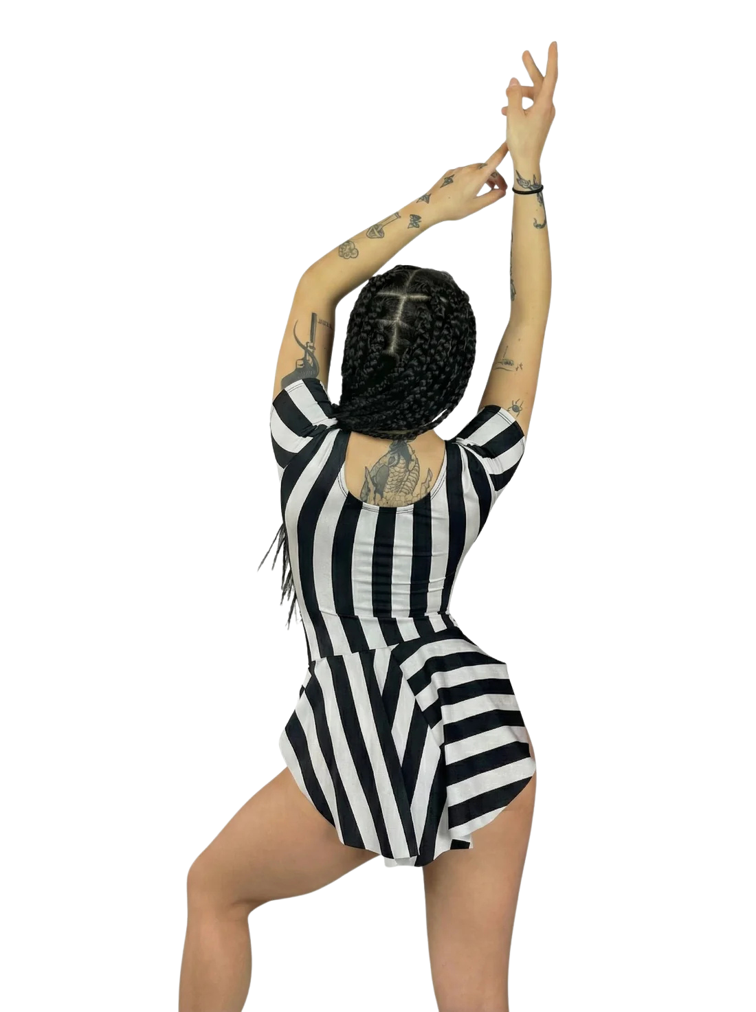 A person with braids and tattoos poses in the Striped Leotard With Skirt—exotic dance wear perfect for aerialists, dance teachers, gymnasts, and fire performers—arms raised against a white background.