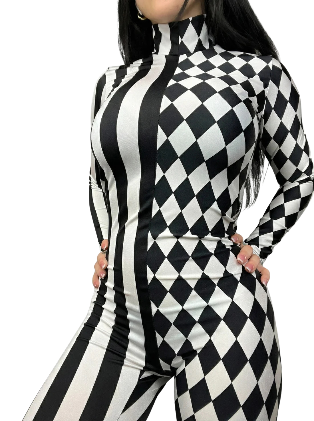 Woman modeling the Black and White Split Fabric Catsuit, featuring stripes and diamond patterns, full sleeves, and a turtleneck; shown from shoulders to thighs with hands on hips.