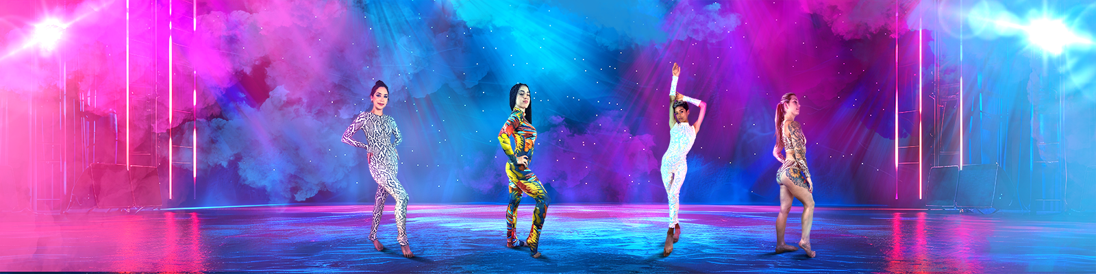 Four performers in colorful, sparkly outfits pose on a lit stage with vibrant pink and blue smoke effects.