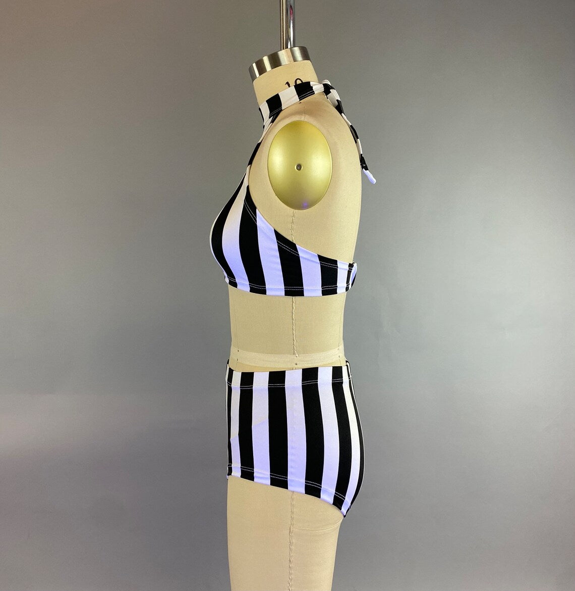 Mannequin wearing the Exotic Dance Costume, a black and white striped bikini set with high-waisted bottoms from the Trending Now collection, against a plain background.