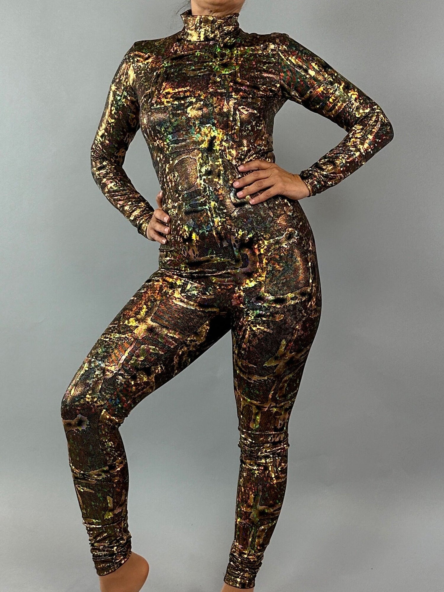 A person in a vibrant, customizable Alien Costume catsuit poses with one hand on their hip against a gray background.