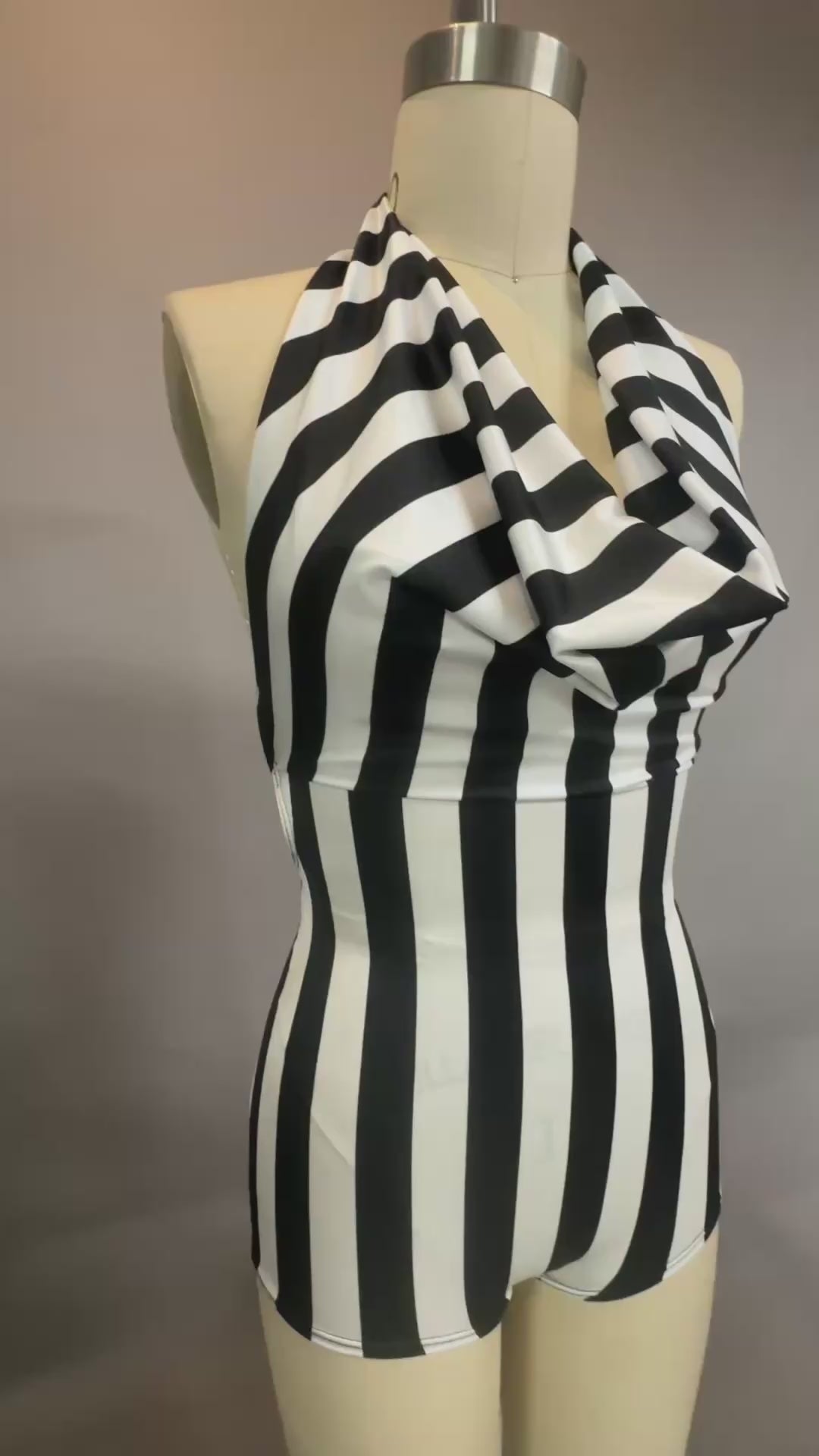 Black and White Striped Leotard. Halter top with open back.