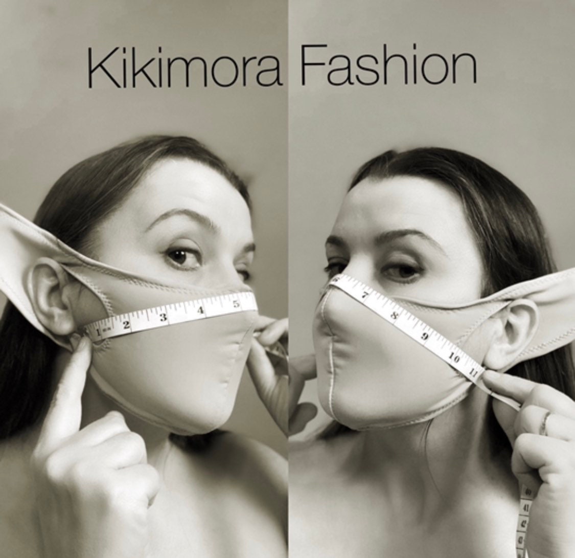 Two women wear Glow Face Mask With 5 Layer HEPA Filter, holding tape measures under “Kikimora Fashion” in black and white—a nod to sustainable fashion.